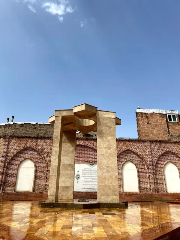 The **Puryā-ye Vali Mausoleum** is a historic tomb complex located in the city of **Khoy**, dedicated to Puryā-ye Vali, a legendary Iranian wrestler, poet, and spiritual figure. The site is an important cultural and symbolic landmark, representing the ideals of chivalry, strength, and moral integrity in Persian tradition. Puryā-ye Vali, believed to have lived during the 13th or 14th century, is remembered not only for his athletic achievements but also for his humility, generosity, and ethical character. He became a symbol of “javanmardi,” a traditional Persian concept that combines bravery, honor, and compassion. His life story has been passed down through folklore, poetry, and oral traditions across Iran and neighboring regions. The mausoleum itself features traditional Iranian architectural elements, including a domed structure, brick construction, and decorative tilework. The interior houses the tomb chamber, where inscriptions and artistic designs reflect both religious and cultural themes. The site has undergone restoration over time to preserve its historical appearance and significance. Culturally, the tomb holds a special place in Iranian sports heritage. Puryā-ye Vali is regarded as a spiritual patron of traditional wrestling, and his name is often associated with ethical conduct in athletics. Wrestlers and athletes frequently visit the mausoleum to pay respect and seek inspiration from his legacy. Visitors to the site can explore the tomb complex, admire its architectural details, and learn about the life and legends of this iconic figure. The mausoleum’s peaceful atmosphere and historical importance make it both a cultural and educational destination. Today, the Mausoleum of Puryā-ye Vali stands as a powerful symbol of Iranian moral values, athletic tradition, and spiritual heritage, preserving the memory of a figure who embodies the timeless ideals of strength guided by honor. The **Puryā-ye Vali Mausoleum** is a historic tomb complex located in the city of **Khoy**, dedicated to Puryā-ye Vali, a legendary Iranian wrestler, poet, and spiritual figure. The site is an important cultural and symbolic landmark, representing the ideals of chivalry, strength, and moral integrity in Persian tradition. Puryā-ye Vali, believed to have lived during the 13th or 14th century, is remembered not only for his athletic achievements but also for his humility, generosity, and ethical character. He became a symbol of “javanmardi,” a traditional Persian concept that combines bravery, honor, and compassion. His life story has been passed down through folklore, poetry, and oral traditions across Iran and neighboring regions. The mausoleum itself features traditional Iranian architectural elements, including a domed structure, brick construction, and decorative tilework. The interior houses the tomb chamber, where inscriptions and artistic designs reflect both religious and cultural themes. The site has undergone restoration over time to preserve its historical appearance and significance. Culturally, the tomb holds a special place in Iranian sports heritage. Puryā-ye Vali is regarded as a spiritual patron of traditional wrestling, and his name is often associated with ethical conduct in athletics. Wrestlers and athletes frequently visit the mausoleum to pay respect and seek inspiration from his legacy. Visitors to the site can explore the tomb complex, admire its architectural details, and learn about the life and legends of this iconic figure. The mausoleum’s peaceful atmosphere and historical importance make it both a cultural and educational destination. Today, the Mausoleum of Puryā-ye Vali stands as a powerful symbol of Iranian moral values, athletic tradition, and spiritual heritage, preserving the memory of a figure who embodies the timeless ideals of strength guided by honor.